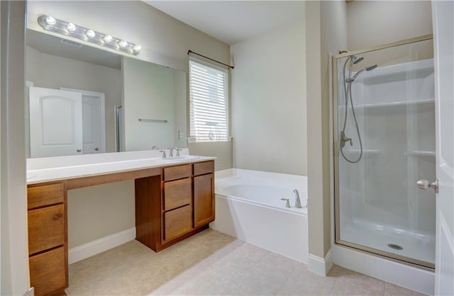 bathroom featuring double vanity, a bath, tile patterned flooring, a shower stall, and a sink