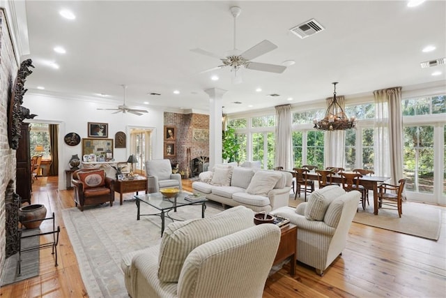 16407 Summerhill Rd, Covington, LA 70435 - living room with a ceiling fan, a brick fireplace, healthy amount of natural light, crown molding, and recessed lighting