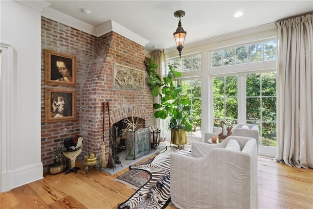 16407 Summerhill Rd, Covington, LA 70435 - living room with wood finished floors, a fireplace, and crown molding