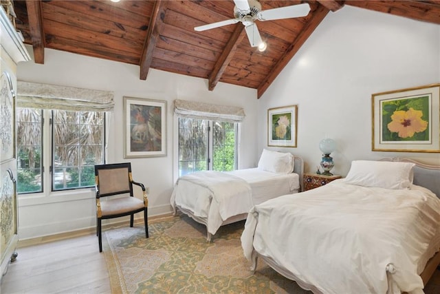 16407 Summerhill Rd, Covington, LA 70435 - bedroom with light wood finished floors, wooden ceiling, beam ceiling, baseboards, and a ceiling fan