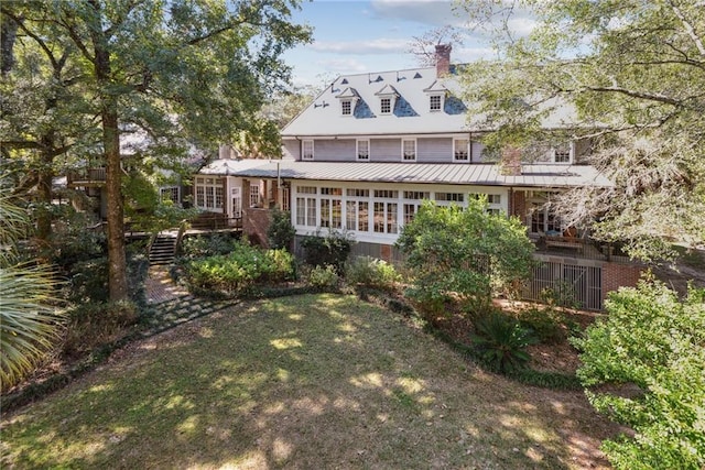 16407 Summerhill Rd, Covington, LA 70435 - rear view of property featuring a chimney, stairway, a yard, and metal roof