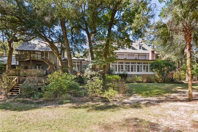 16407 Summerhill Rd, Covington, LA 70435 - rear view of property with stairs, a wooden deck, and a lawn
