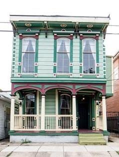 1418 Kerlerec St, New Orleans, LA 70116 - italianate-style house featuring covered porch