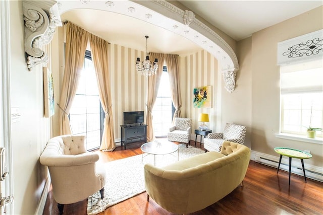 1418 Kerlerec St, New Orleans, LA 70116 - living area featuring wallpapered walls, an inviting chandelier, plenty of natural light, and wood finished floors