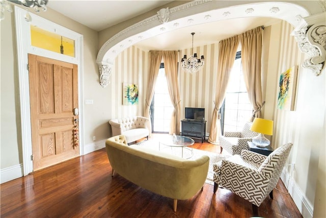 1418 Kerlerec St, New Orleans, LA 70116 - sitting room featuring baseboards, wood finished floors, a chandelier, and wallpapered walls