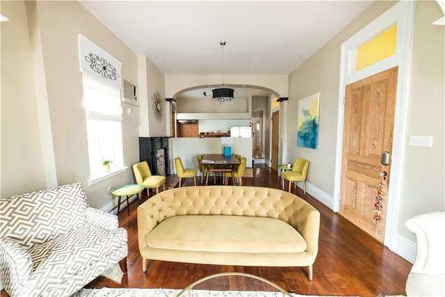 1418 Kerlerec St, New Orleans, LA 70116 - living area with baseboards, arched walkways, and wood finished floors
