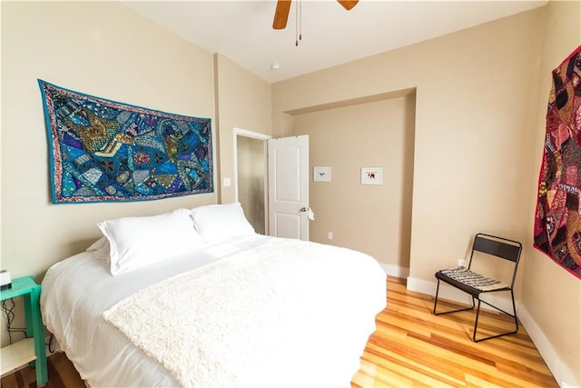 1418 Kerlerec St, New Orleans, LA 70116 - bedroom with light wood-style floors, baseboards, and ceiling fan
