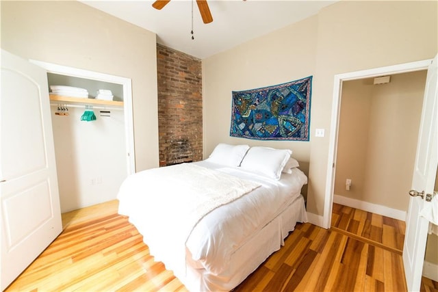 1418 Kerlerec St, New Orleans, LA 70116 - bedroom featuring a ceiling fan, a closet, and wood finished floors