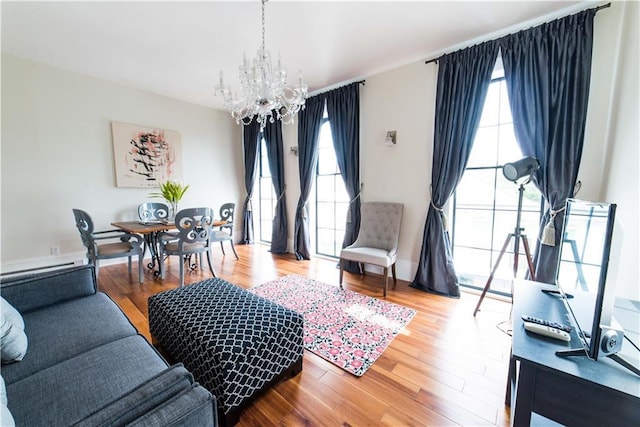 1418 Kerlerec St, New Orleans, LA 70116 - living area featuring a chandelier, plenty of natural light, and wood finished floors