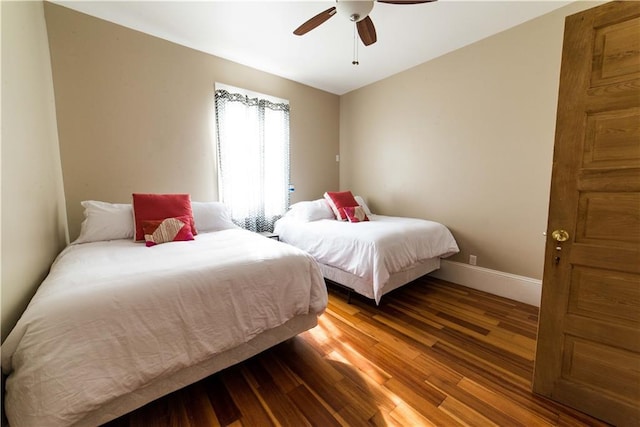 1418 Kerlerec St, New Orleans, LA 70116 - bedroom featuring baseboards, ceiling fan, and wood finished floors