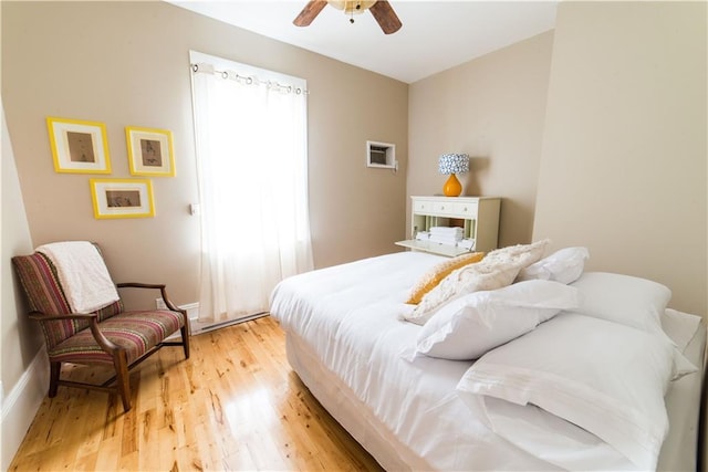 1418 Kerlerec St, New Orleans, LA 70116 - bedroom with baseboards, a ceiling fan, and light wood-style flooring