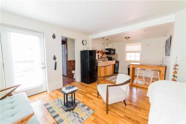 1418 Kerlerec St, New Orleans, LA 70116 - living room with baseboards and light wood finished floors