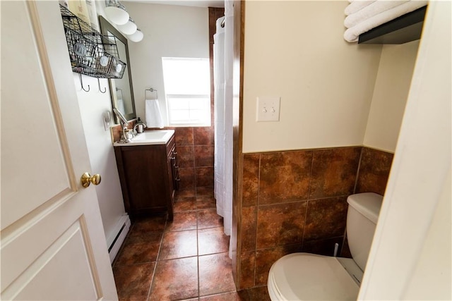 1418 Kerlerec St, New Orleans, LA 70116 - bathroom featuring toilet, tile patterned floors, tile walls, and vanity