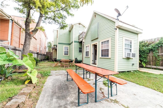 1418 Kerlerec St, New Orleans, LA 70116 - back of house with a patio, a fenced backyard, and outdoor dining space