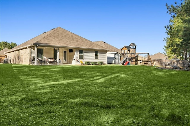 23162 Rosa Blvd, Robert, LA 70455 - back of property with a yard, fence, a playground, and a patio area