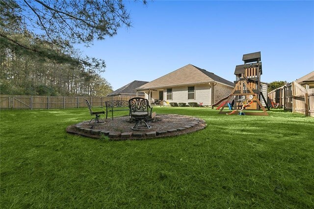 23162 Rosa Blvd, Robert, LA 70455 - view of yard featuring a playground and a fenced backyard