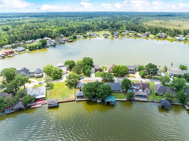 14300 S Lakeshore Dr, Covington, LA 70435 - aerial view of residential area featuring a heavily wooded area and a large body of water