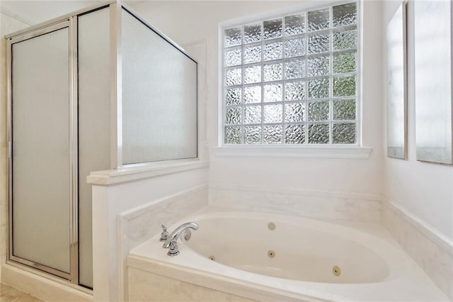 14300 S Lakeshore Dr, Covington, LA 70435 - full bathroom with a stall shower and a jetted tub