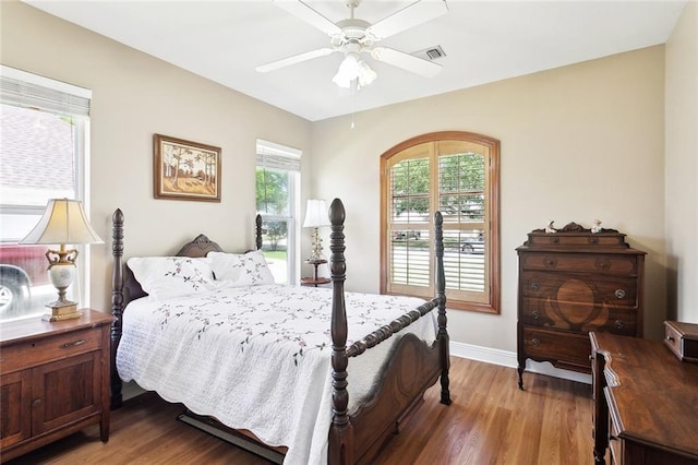 14300 S Lakeshore Dr, Covington, LA 70435 - bedroom featuring light wood-style floors, baseboards, and a ceiling fan