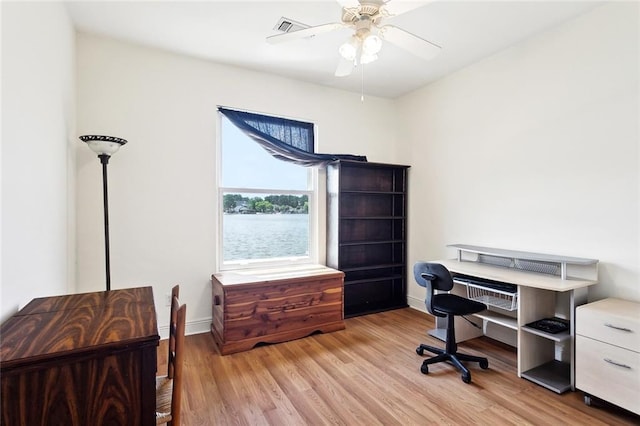 14300 S Lakeshore Dr, Covington, LA 70435 - office featuring wood finished floors, ceiling fan, and baseboards