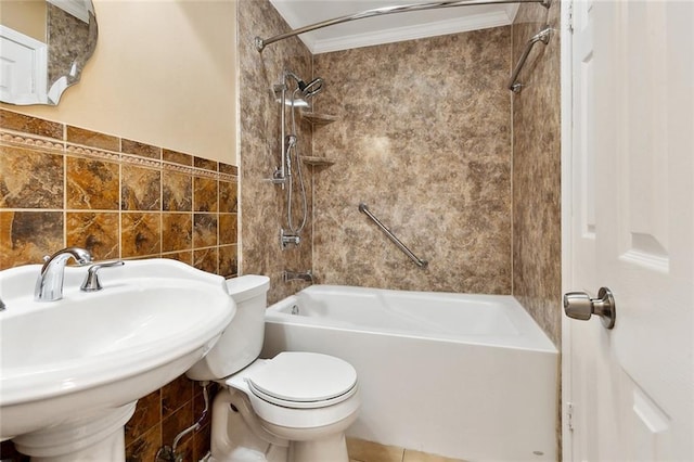 bathroom with crown molding, bathing tub / shower combination, toilet, tile walls, and a sink