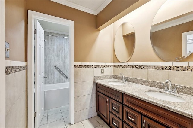 full bath with tile walls, a sink, and tile patterned flooring