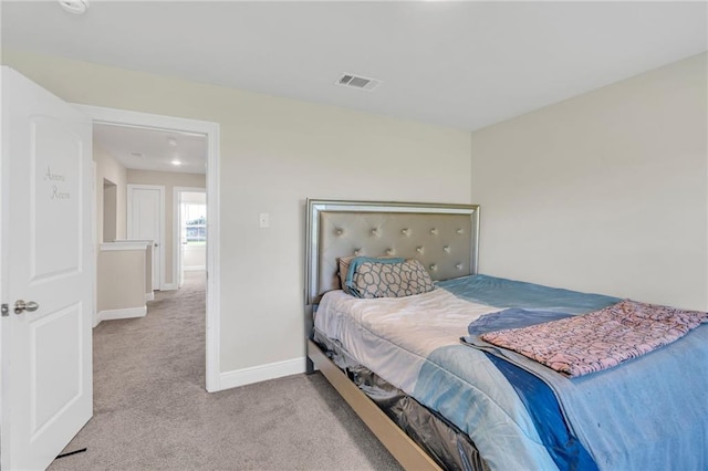 bedroom with visible vents, carpet, and baseboards
