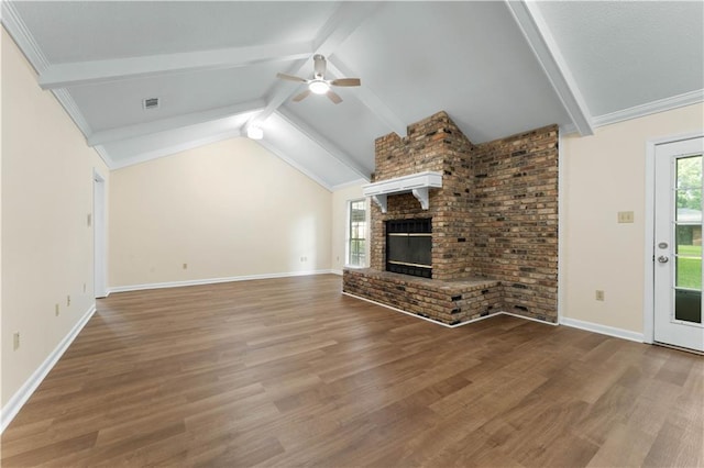 unfurnished living room with ceiling fan, a wealth of natural light, and wood finished floors