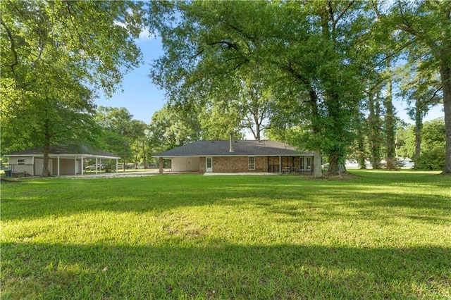 view of yard featuring a carport
