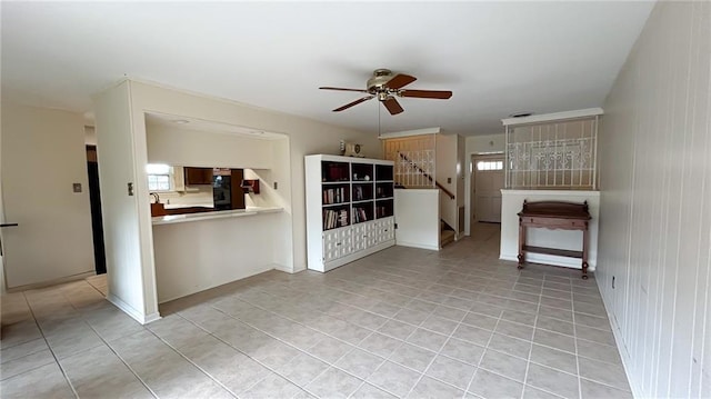 unfurnished living room featuring stairway, ceiling fan, and light tile patterned flooring