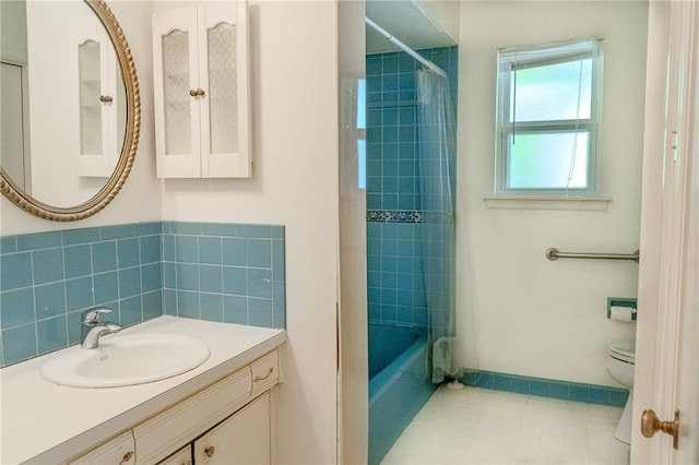 full bath with vanity, tile patterned flooring, toilet, and tub / shower combination
