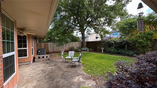 5001 Tartan Dr, Metairie, LA 70003 - fenced backyard featuring a ceiling fan and a patio area