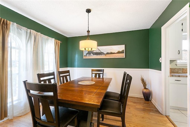 dining space with light wood finished floors