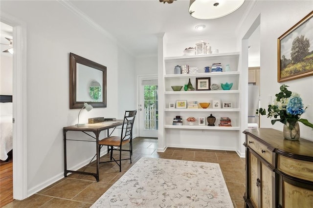 interior space featuring ornamental molding and dark tile patterned flooring