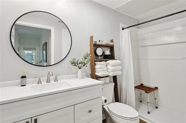 bathroom with vanity, toilet, and a shower with shower curtain
