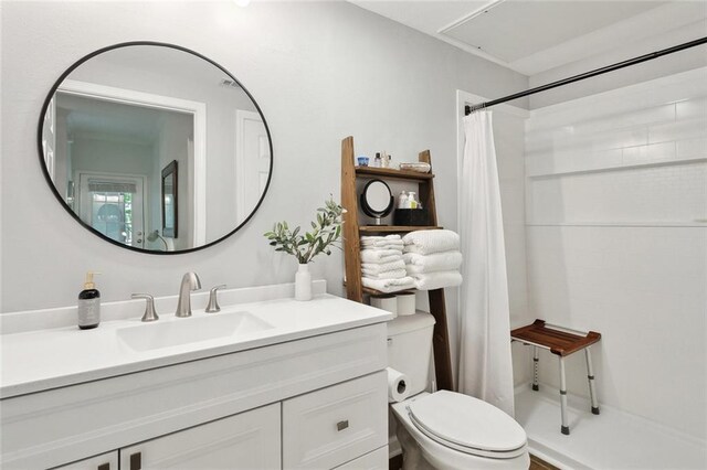 350 Emerald Forest Blvd Unit 28109, Covington, LA 70433 - bathroom featuring a shower with shower curtain, toilet, and vanity