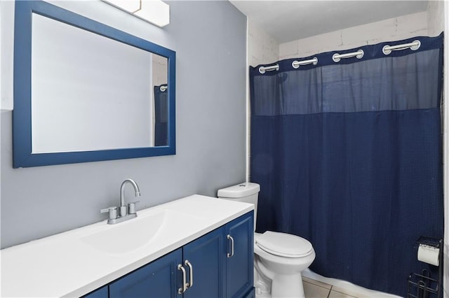 3205 Lake Trail Dr, Metairie, LA 70003 - full bath with vanity, tile patterned floors, toilet, and a shower with shower curtain