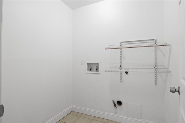 3205 Lake Trail Dr, Metairie, LA 70003 - laundry room with laundry area, baseboards, light tile patterned flooring, and washer hookup