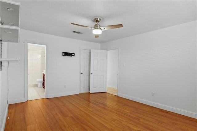 3205 Lake Trail Dr, Metairie, LA 70003 - unfurnished bedroom with visible vents, baseboards, wood finished floors, and a closet