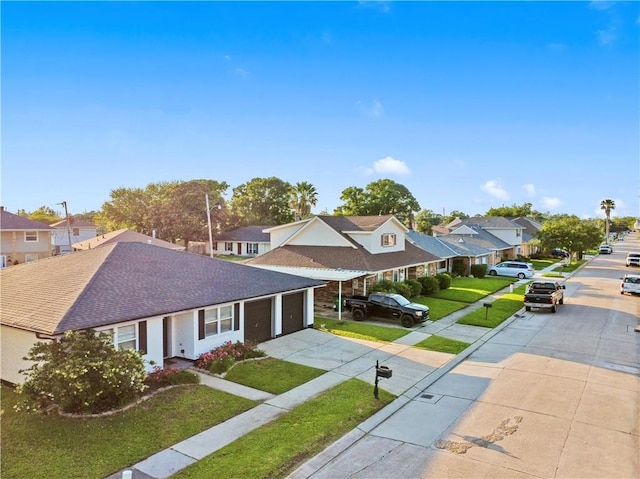 3205 Lake Trail Dr, Metairie, LA 70003 - view of front facade with a residential view, a shingled roof, a garage, a front yard, and driveway