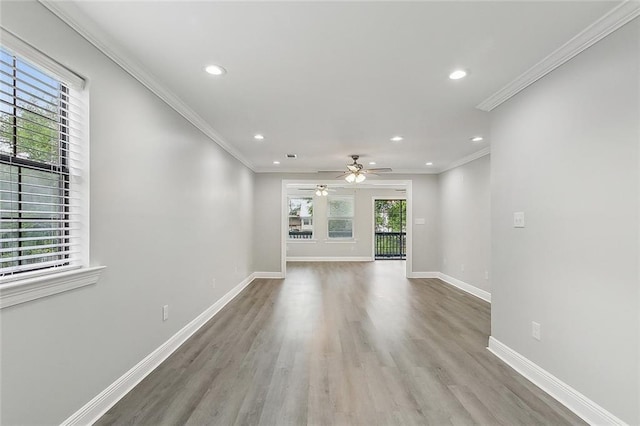 unfurnished living room featuring recessed lighting, baseboards, ornamental molding, ceiling fan, and wood finished floors