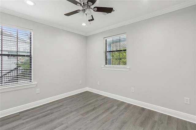 unfurnished room featuring wood finished floors, a healthy amount of sunlight, and recessed lighting
