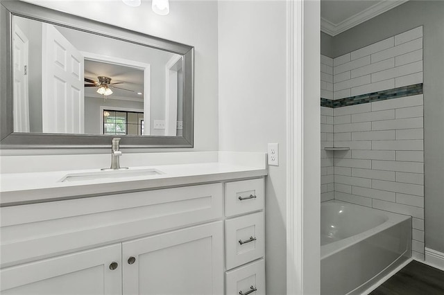 2951 Camellia Dr, Slidell, LA 70458 - full bath with ornamental molding, a ceiling fan, vanity, shower / washtub combination, and wood finished floors