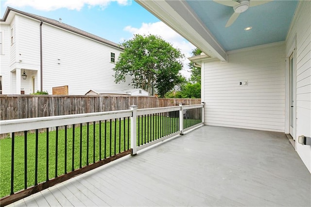 exterior space with a ceiling fan, a fenced backyard, and a yard