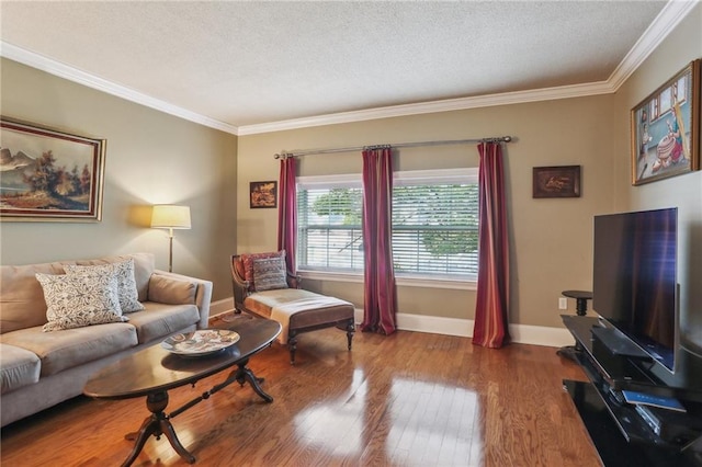 living area with crown molding, a textured ceiling, baseboards, and hardwood / wood-style flooring