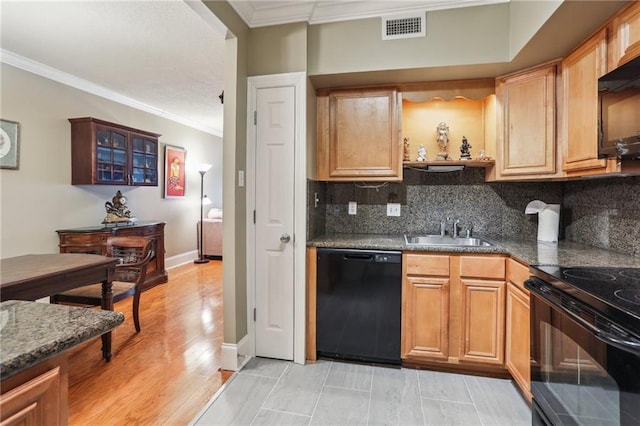 kitchen with decorative backsplash, visible vents, crown molding, a sink, and black appliances