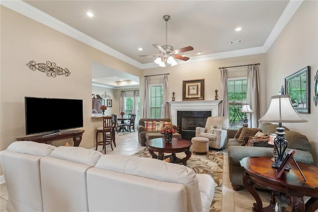 living room featuring ornamental molding, a ceiling fan, recessed lighting, and visible vents