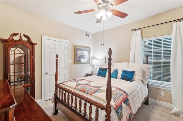 bedroom featuring baseboards, visible vents, ceiling fan, and carpet