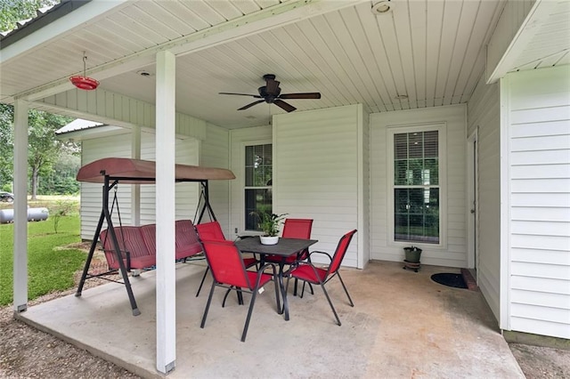 view of patio featuring outdoor dining area and ceiling fan