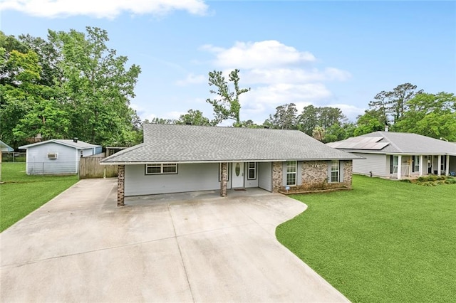 8752 Leisure Dr, Denham Springs, LA 70726 - ranch-style house featuring concrete driveway, fence, and a front yard
